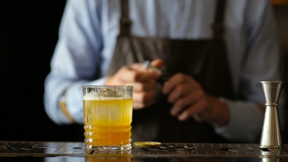 Bartender Nicely Sprays a Cocktail Of Alcohol