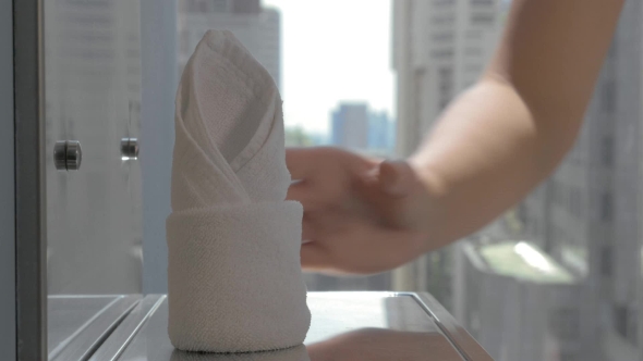 Placing Clean Towels In The Hotel Bathroom