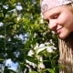 Girl With Dreadlocked Smelling a Flower. - VideoHive Item for Sale