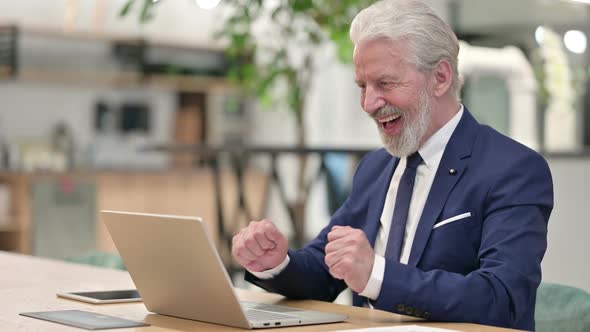 Senior Old Businessman Celebrating Success on Laptop