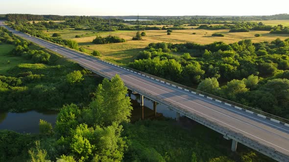 A Bridge That Cars Drive Across A Wide River