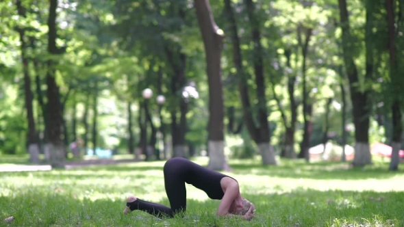 Woman Doing Headstand.