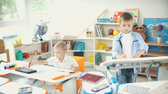 Two Boys Painting In a Beautiful Nursery