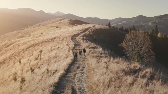 Tourists Hiking at Burnt Grass Field Aerial