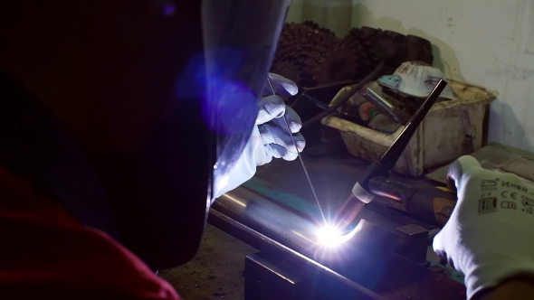 Welder At Factory Work