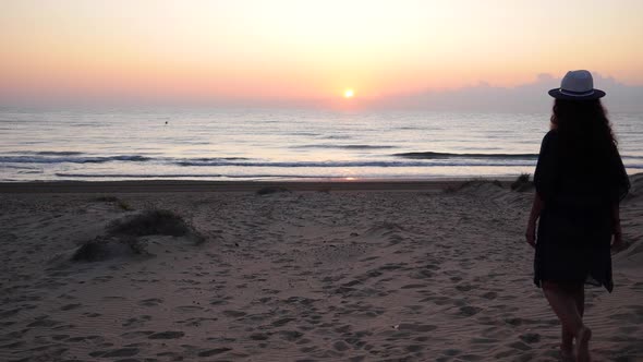 Woman in slow-motion at sunrise