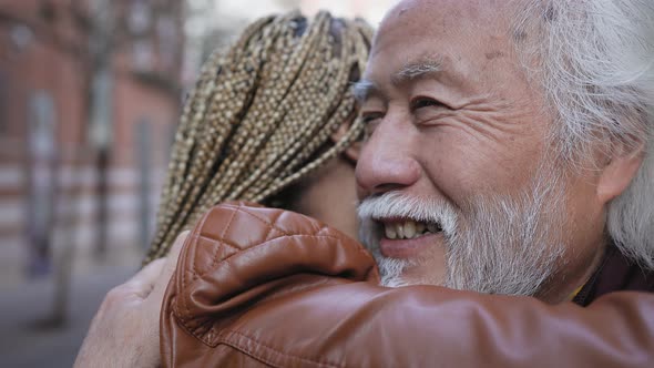 Happy senior couple having tender moments in city - Elderly people and love relationship concept