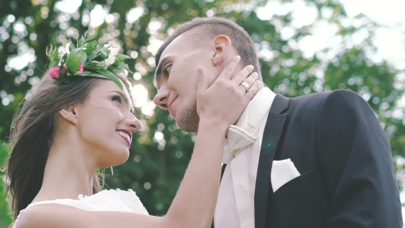 Loving Wedding Couple Looking Into Each Others Eyes. Slowly