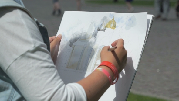 Girl Painting a Picture Of The Church Outdoors