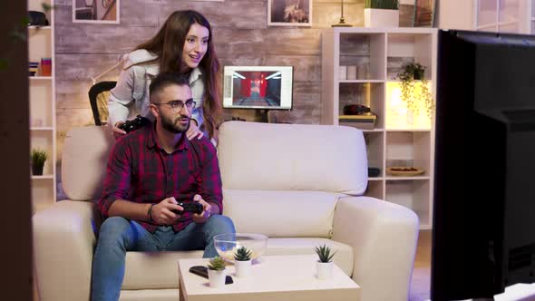 Man Playing Video Games on Television