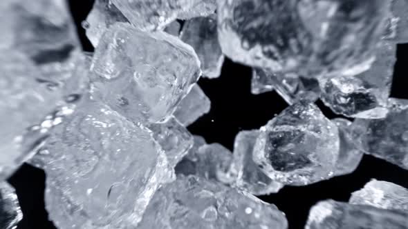 Super Slow Motion Shot of Falling Ice Cubes on Black Background at 1000Fps