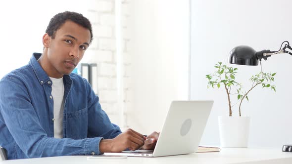 Afro-American Man Looking toward Camera