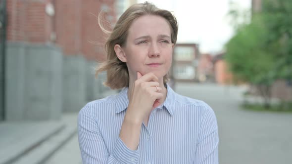 Portrait of Pensive Woman Thinking Outdoor