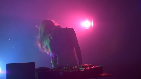 Sexy Blonde Dj Girl Flipping Hair and Turns, Dancing, Silhouette, Slow Motion, Pink Backlight