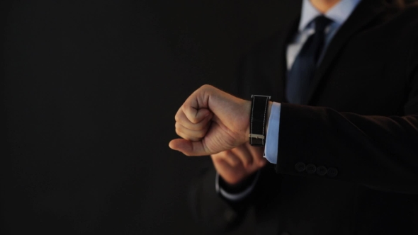 Businessman Pointing To Smart Watch On His Hand