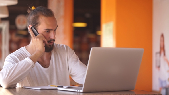 Young Businessman Talking On The Phone