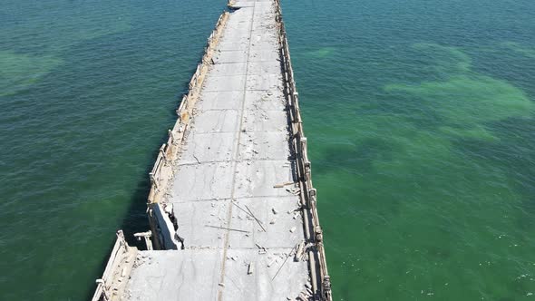 Large missing chunks of concrete and broken cement railing show the wear of time in this hurricane d