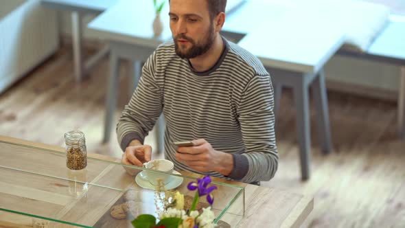 Man Drinking Coffee and Thinking