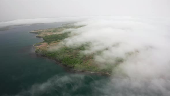 Aerial View of the Green Rocky Coastline and Clear Turquoise Sea in Asia