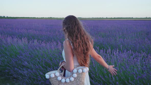 Girl Walks Near Purple Lavender Field