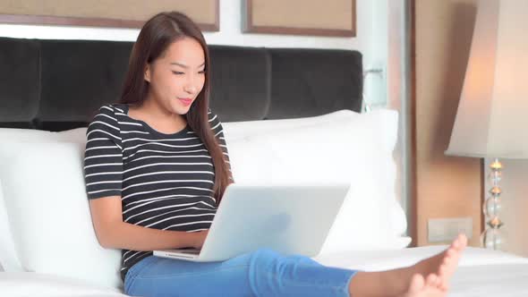 Young asian woman use laptop