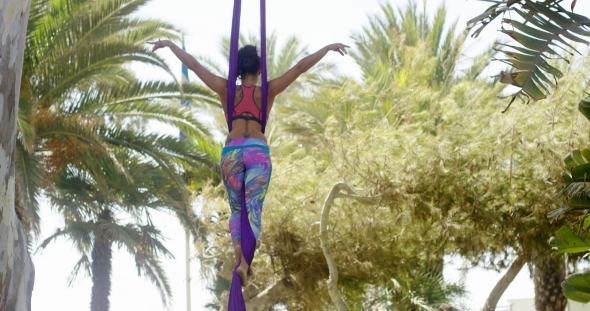 Fit Young Acrobat Dancer Practicing Her Routine