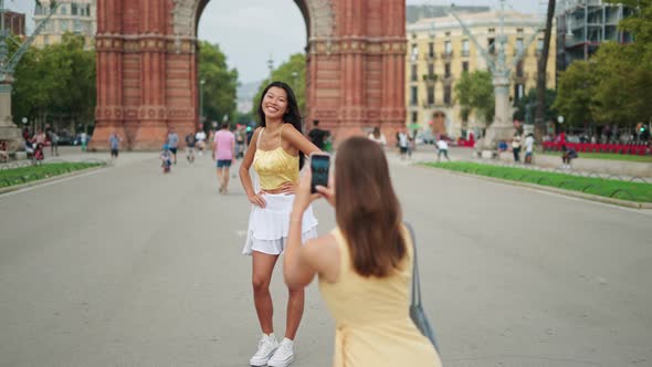 Stylish Female Tourists Photographing in City