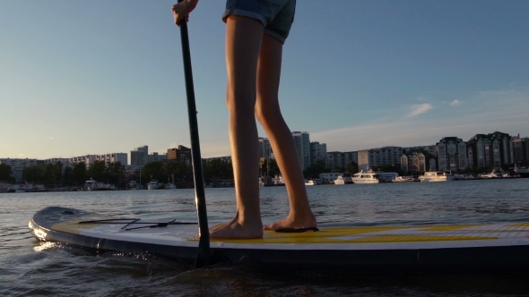 Beautiful Woman On Stand Up Paddle Board