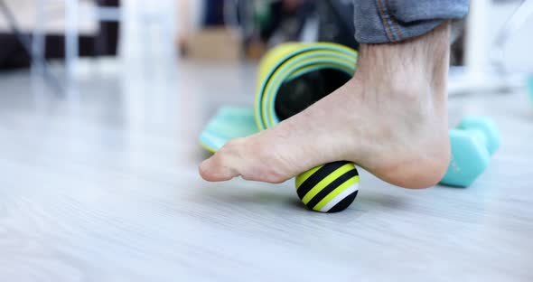 Man Leg Rolling Sports Ball for Prevention and Treatment of Flat Feet Closeup
