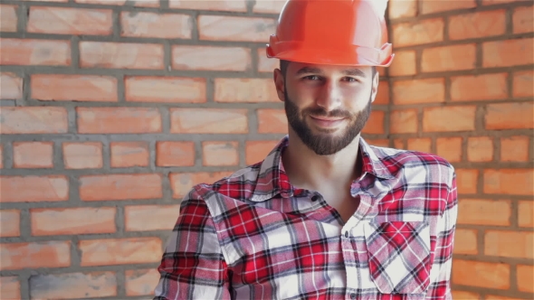 Builder Gestures Good Quality At The Building Under Construction