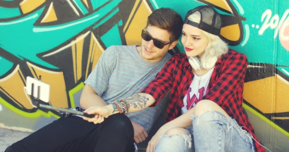 Trendy Young Hipster Couple Taking a Selfie