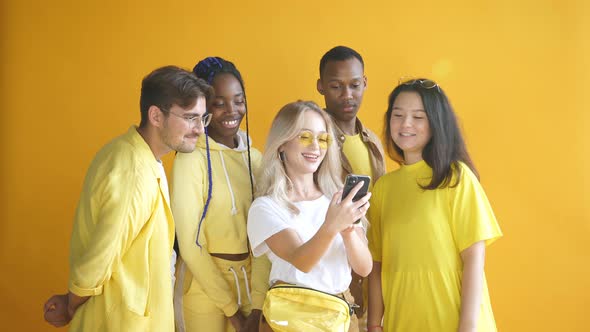 Confident Diverse Multiethnic Group of People Stand Together Isolated on Yellow Background