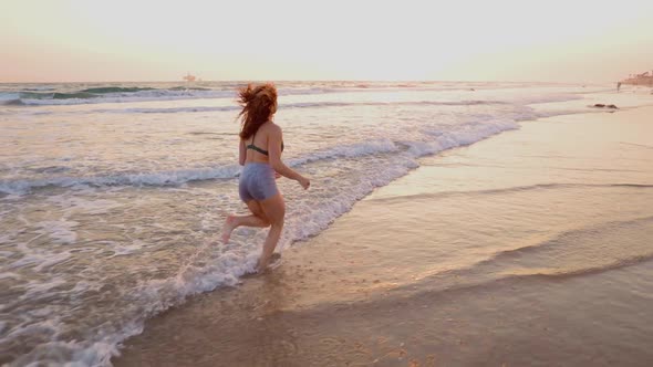 Athletic Woman Working Out At The Beach