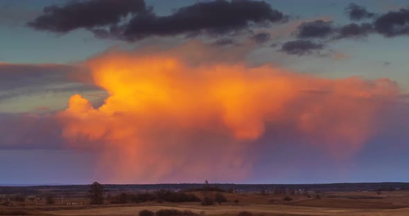 Cumulonimbus Storm Clouds at Sunset.  UHD Timelapse