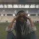 Nervous Sporty African-american Woman Sitting Alone In The Middle Og Sports Stadium And Looking To - VideoHive Item for Sale