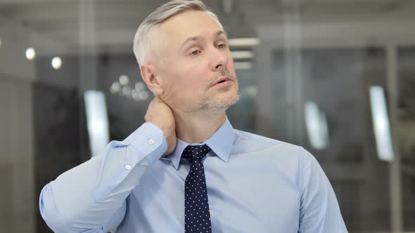 Tired Grey Hair Businessman with Neck Pain, Workload