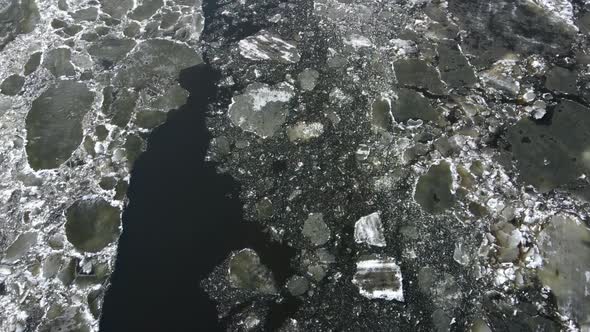 In the Spring Ice Floes Float Down the River