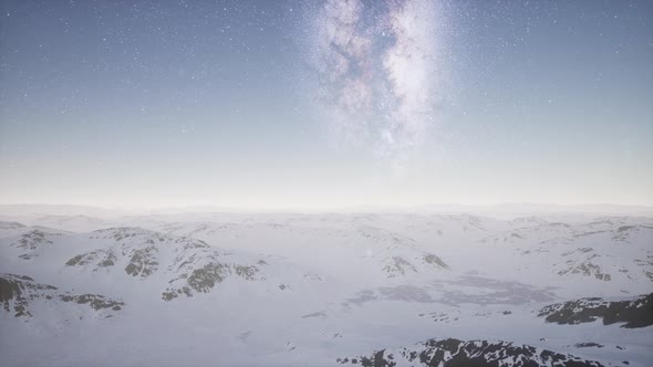 Milky Way Above Snow Covered Terrain alt