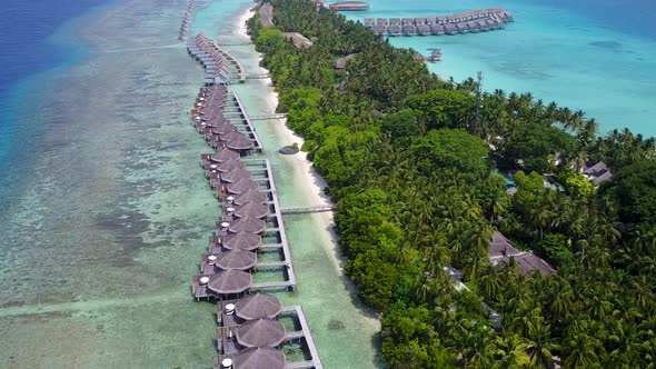 Sunny tourism of resort beach trip by blue sea with sand background after sunrise