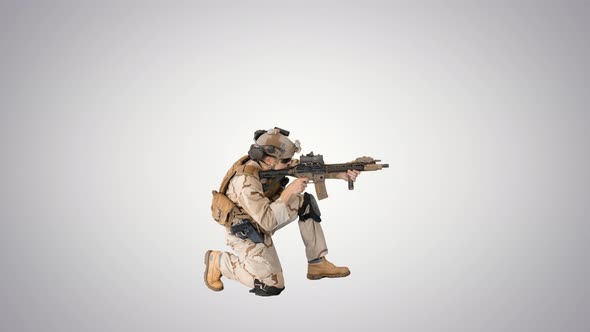 Soldier Sits Down for Aiming and Shooting with Rifle on Gradient Background.