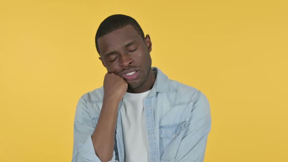 Sleepy Young African Man Taking Nap Yellow Background