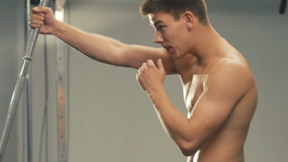 Boxer Training Arm with Workout Equipment in the Gym