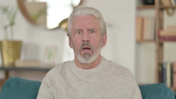 Old Man Reacting to Loss