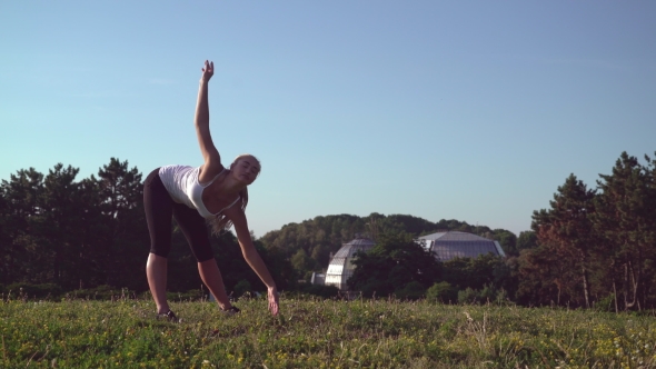 Female Warming - Up Muscles At The Open Air