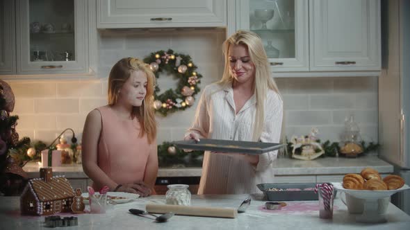 Family Christmas  Mother and Her Daughter Making Cookies