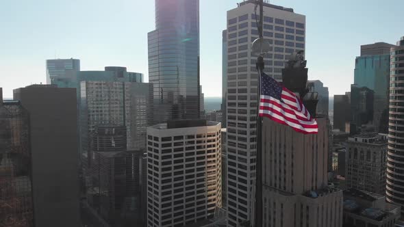 United States flag, Downtown Minneapolis aerial footage in the background