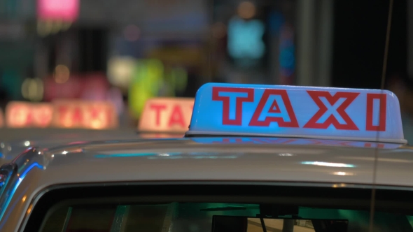 Taxi Sign On Cabs Waiting People. Hong Kong, China