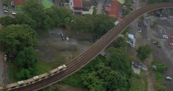 Railway With a Passing Train In City Of Kuala Lumpur, Malaysia alt