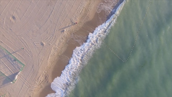 Flying Above Sand Sea Beach