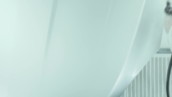 Automotive Paint. Mechanic Painting The Car In Auto Repair Shop